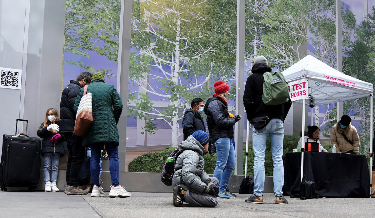 Travelers line up for a COVID-19 test in New York City